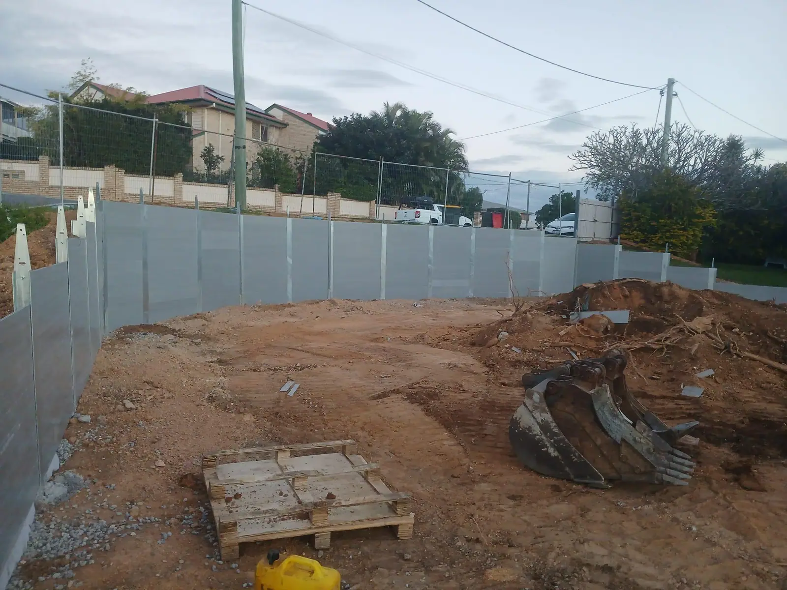 Curved SuperSleeper retaining wall under construction
