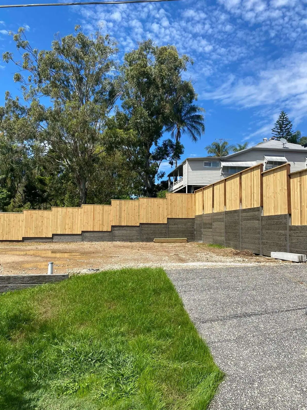 Residential timber fencing and concrete sleeper garden walls