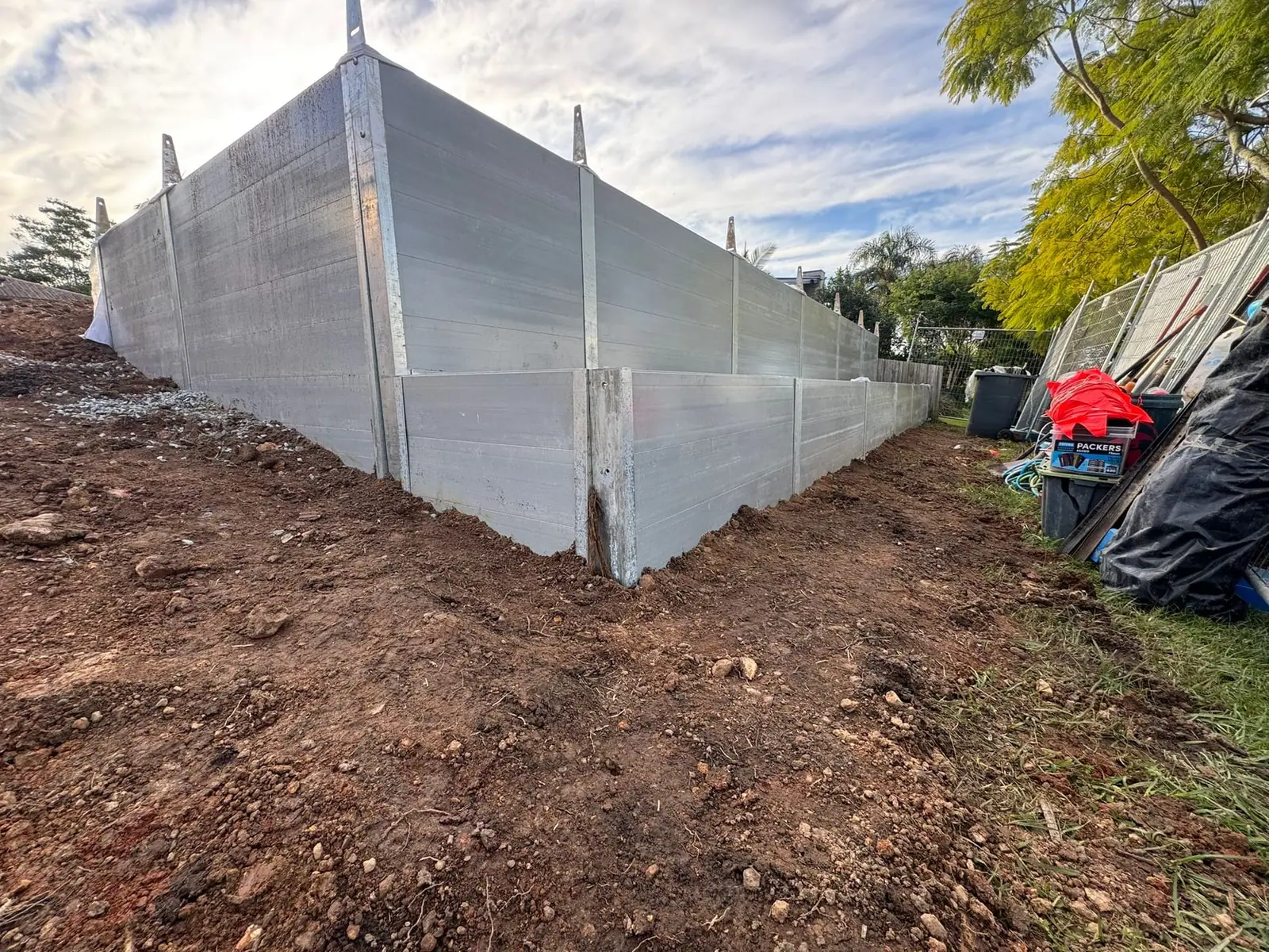 Long SuperSleeper retaining wall installation on a development site