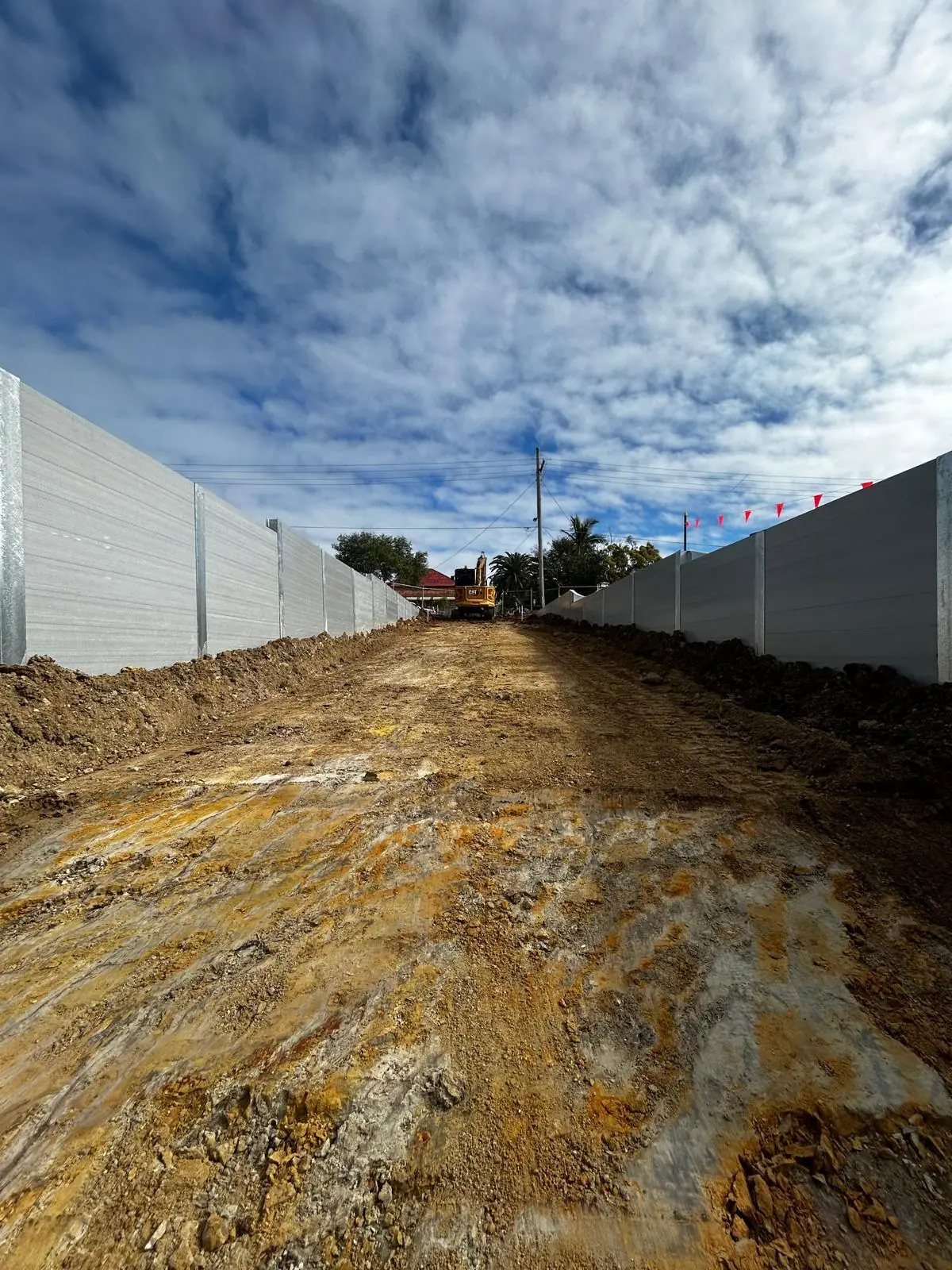 Twin SuperSleeper retaining walls along a civil access road