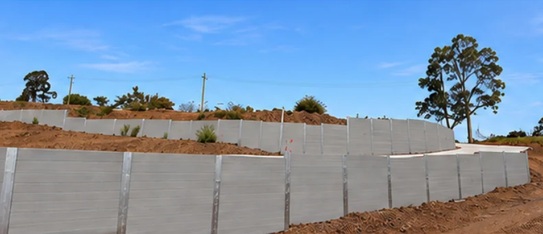 Stepped grey SuperSleeper retaining walls installed for Langhus in Booval