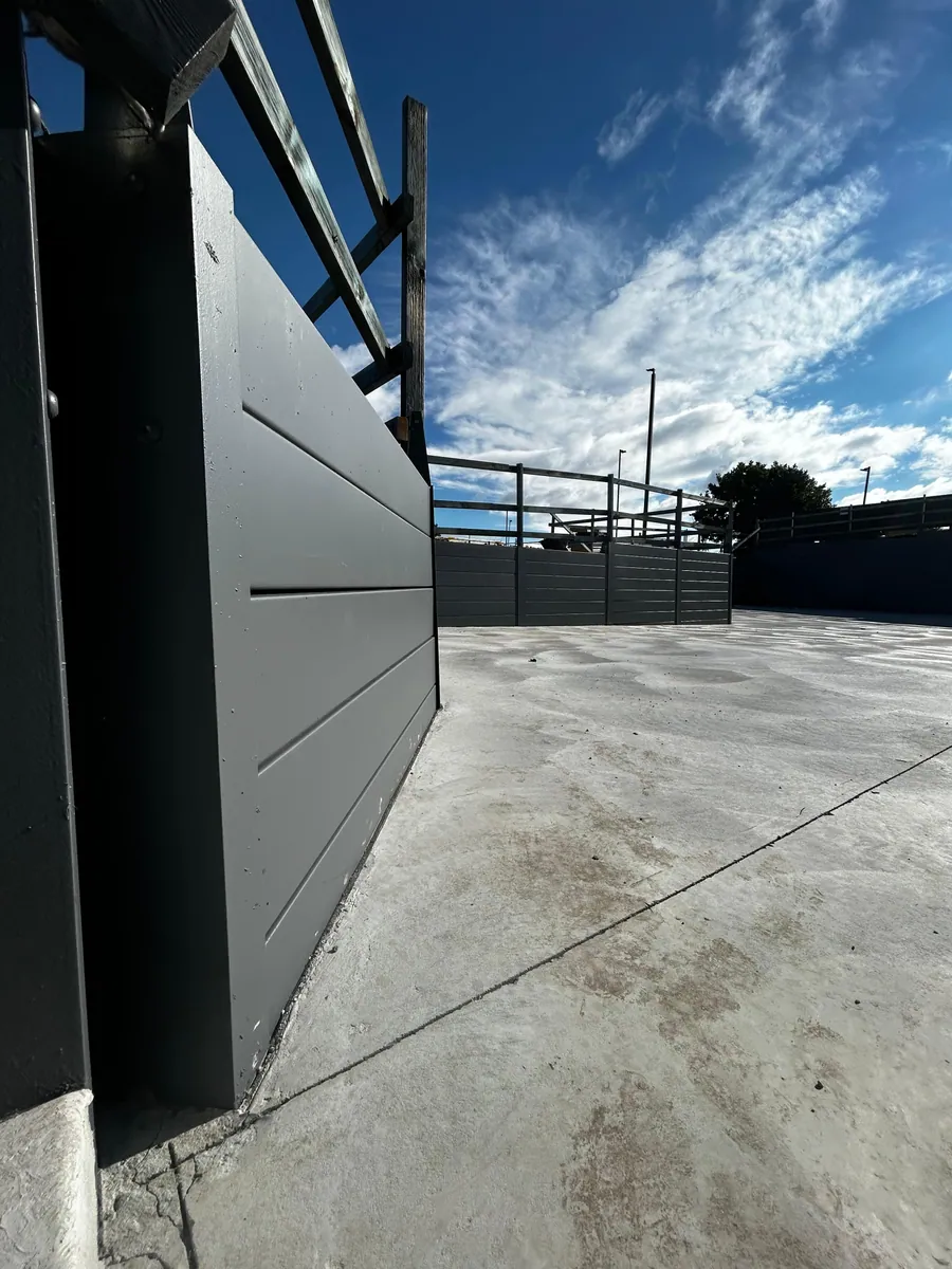 Charcoal SuperSleeper wall at a commercial courtyard entry