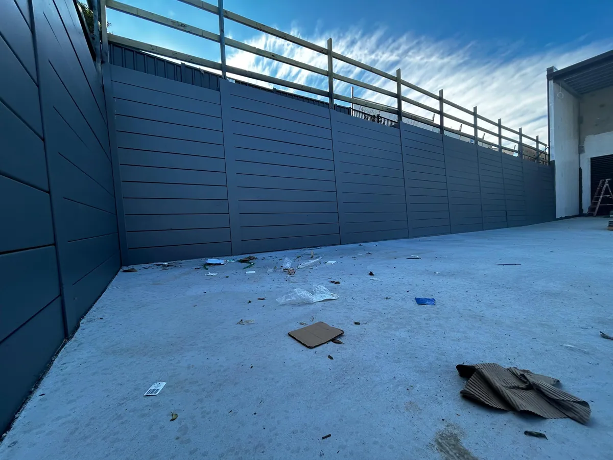 Commercial SuperSleeper retaining wall with safety railing