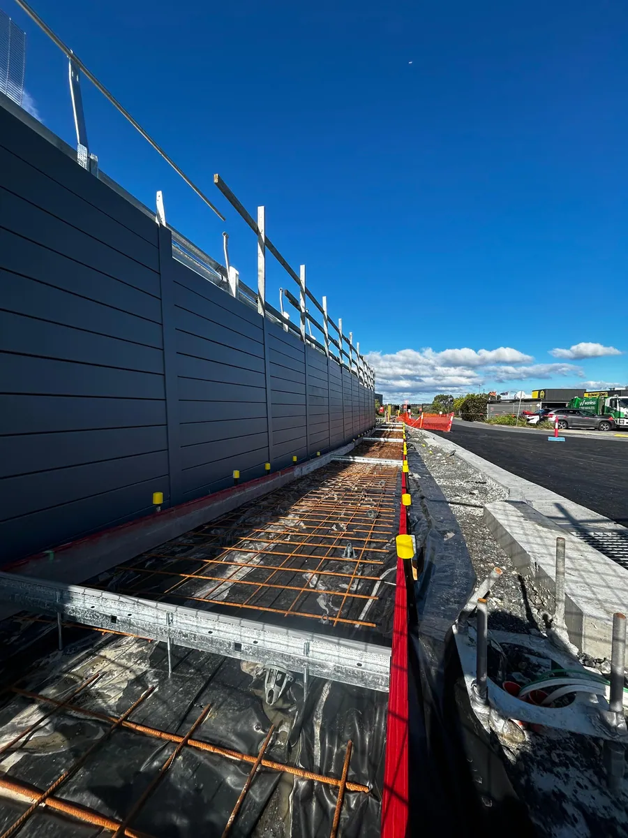Charcoal commercial retaining wall during roadside construction