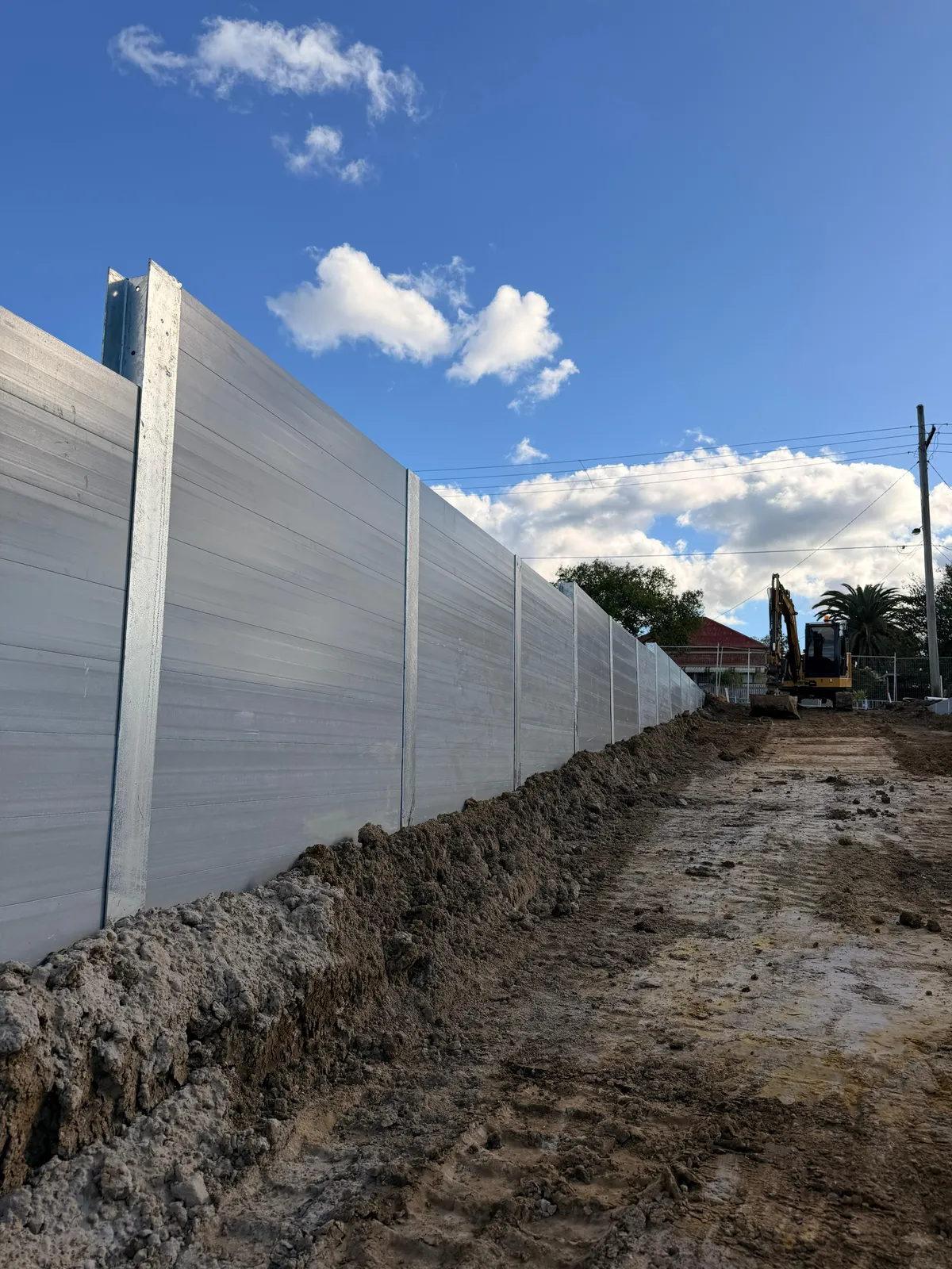 Close view of foundations being drilled for SuperSleeper posts